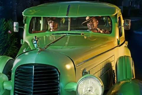 Couple in green vintage car