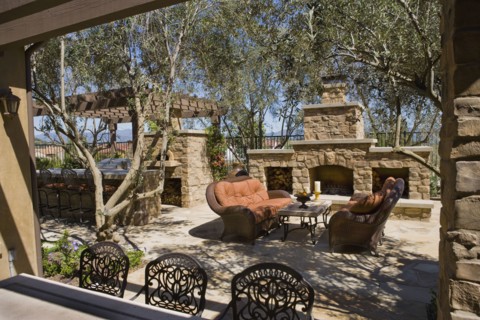 View over backyard bar to sitting area near fireplace