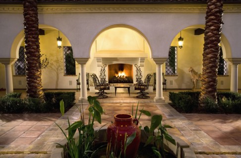 Sitting area with fireplace in courtyard