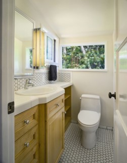Traditional half bath with white tile