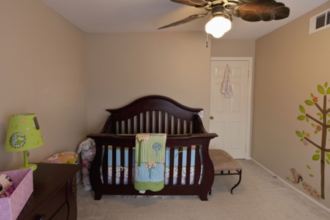 Wooden crib in baby nursery