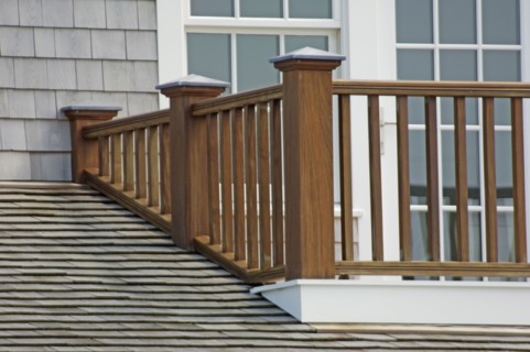 Wooden balcony railing and shingled roof