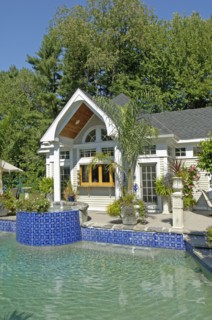 Swimming pool in front of pool house