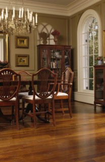 Elegant dining room with oak hardwood floors and hepplewhite style dining chairs