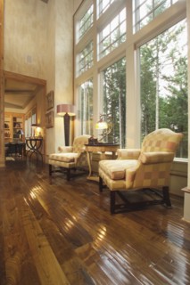 Two armchairs in front of large picture windows