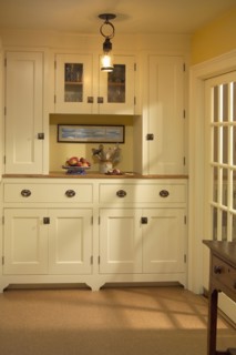 Kitchen pantry area with cabinets