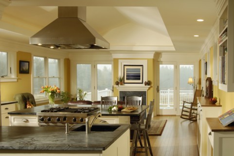 Contemporary kitchen with granite countertops and a stainless steel range vent