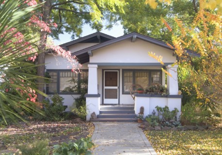 Front exterior white bungalow with blue trim