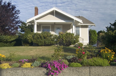 Exterior one story brown house with white trim at Bellingham