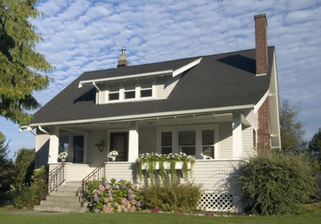 Exterior two story brown house with black roof at Bellingham