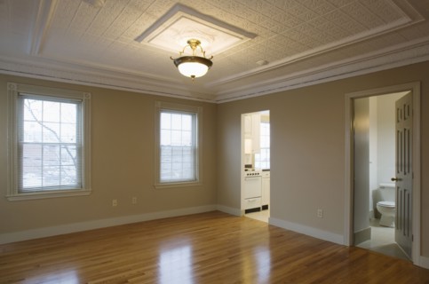 Empty room in apartment with hardwood floor
