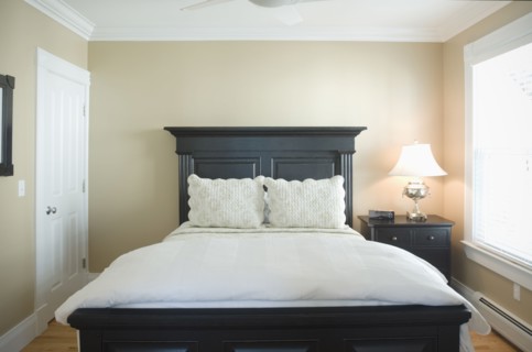 Contemporary bedroom with black bed