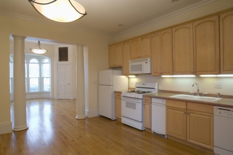 Hardwood floor in spacious traditional kitchen
