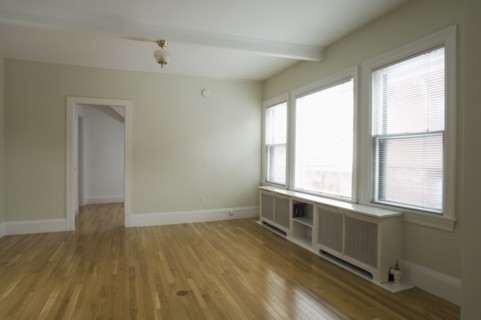 Empty room in apartment with hardwood floor