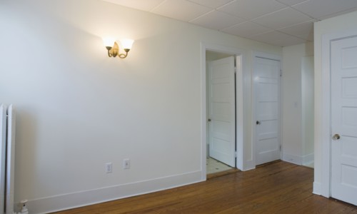 Empty room in apartment with hardwood floor
