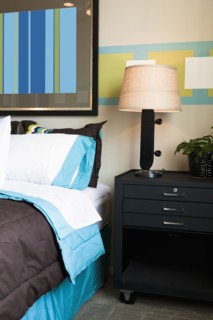 Skateboard lamp on nightstand in boy's room