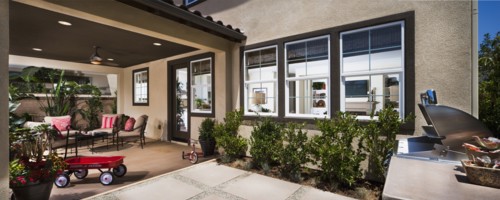 Back patio behind traditional American home