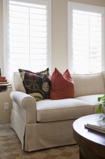 Cropped couch with coffee table in living room at home
