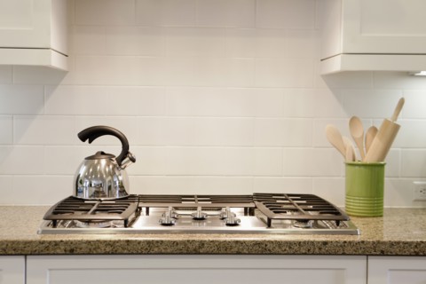 Close-up of a kettle on stove in the kitchen at home