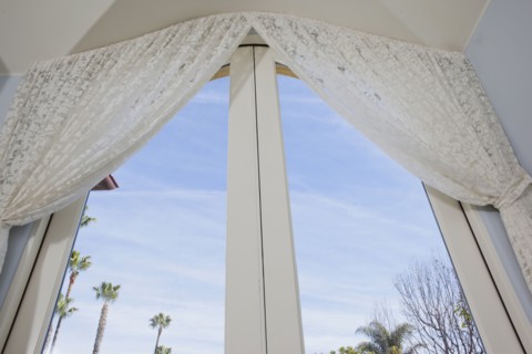 Low angle view of curtain on glass door at home
