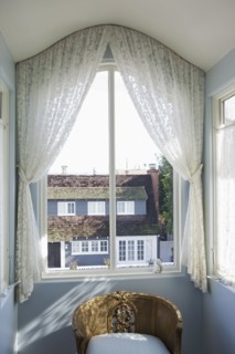 View of curtain on glass window at home