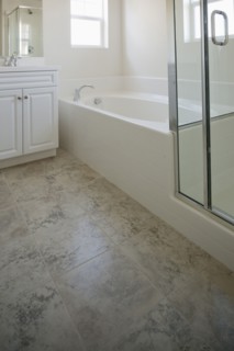 Bathroom with bath and cabinets at home