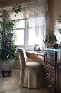 Chair at dressing table in bathroom at home