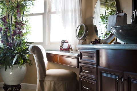 Chair at dressing table in bathroom at home