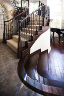 Tiled and wooden floor with stairs at home