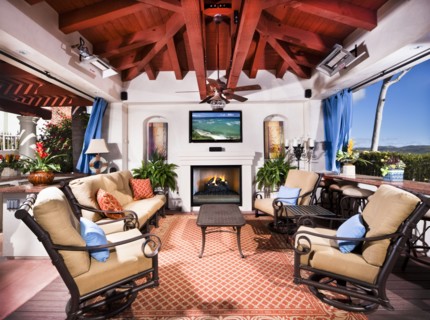 View of sitting area with fireplace at covered patio