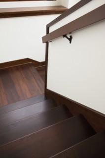 High angle view of wooden stairs with handrail at home