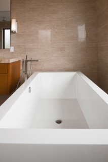Contemporary bathroom with white bath at home