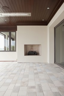 Covered patio with fireplace at Newport Beach