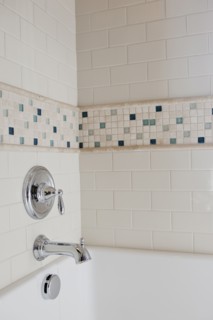 Close-up of shower taps in bathroom at home