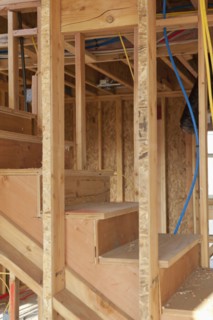 Wooden steps of incomplete house under construction
