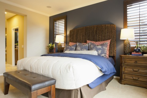 Interior of tidy bedroom of middle class house