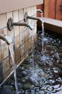 Water flowing from fountains outside house