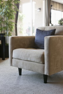Cushion on comfortable armchair in living room