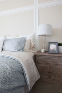Night table by bed in middle class house