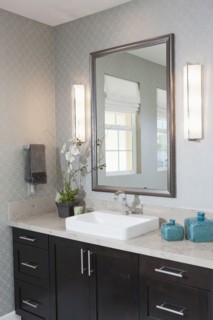Mirror and cabinets at bathroom sink