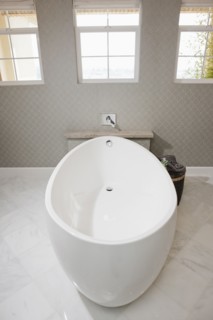 White free standing bathtub in contemporary bathroom