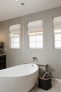 Free standing bathtub in contemporary bathroom