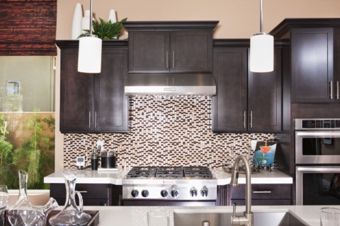 Interior of domestic kitchen with wooden cabinets