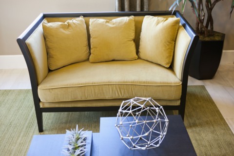 Yellow colored cushions and sofa in living room