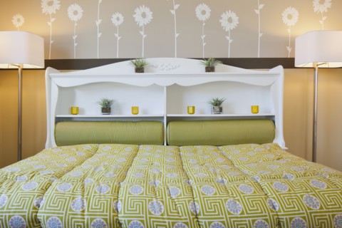 Interior of child's bed with floor lamps