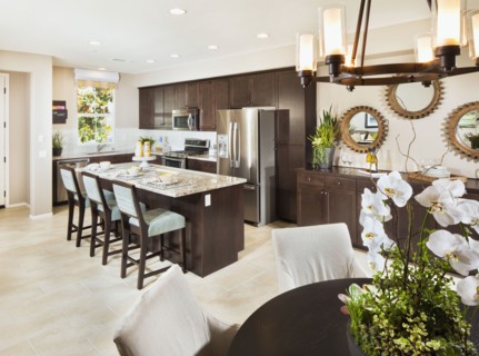 View of domestic kitchen through dining area