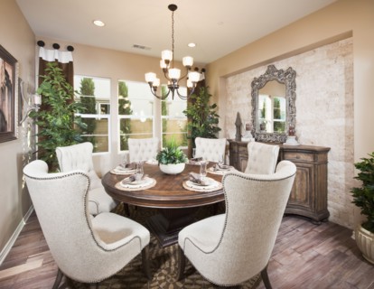 Wingback chairs at dining table in house