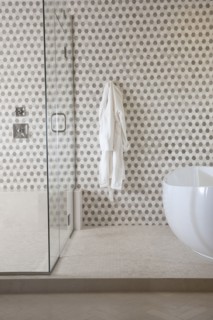 Contemporary bathroom with cropped bath and glass shower at home
