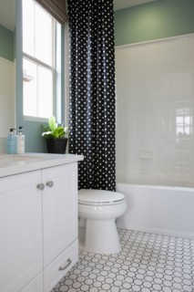 White cabinet with commode in the bathroom at home