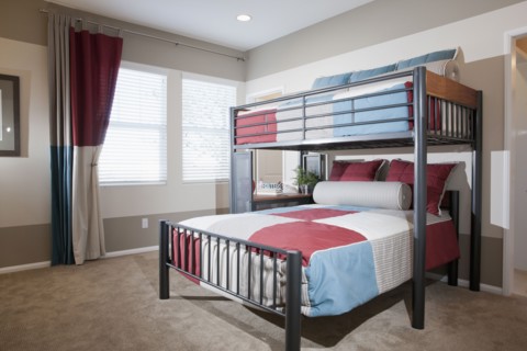 Bunk bed with carpeted floor at home
